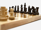 Classic chess set shown folded with carry handle
