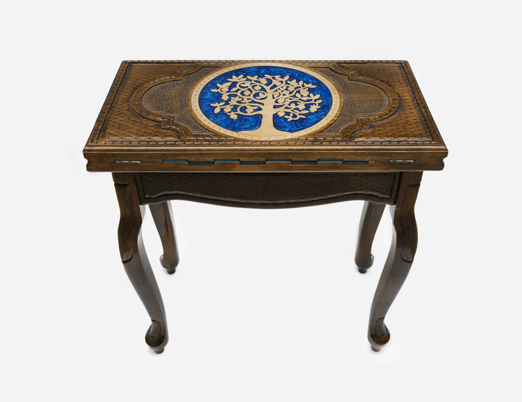 Close-up of the carved Tree of Life motif with blue epoxy accents