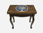 Close-up of the carved Tree of Life motif with blue epoxy accents