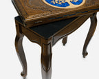 Side view of the chess table on its curved cabriole legs
