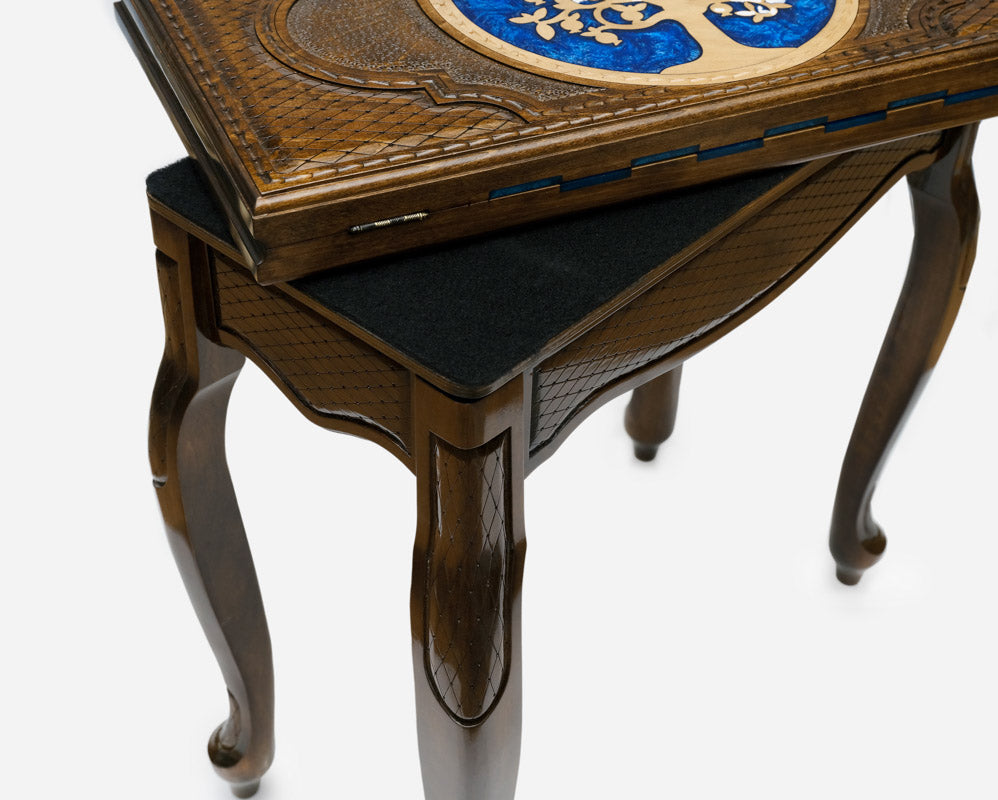 Side view of the chess table on its curved cabriole legs