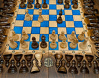 Overhead view of the blue epoxy chess board and its wooden pieces