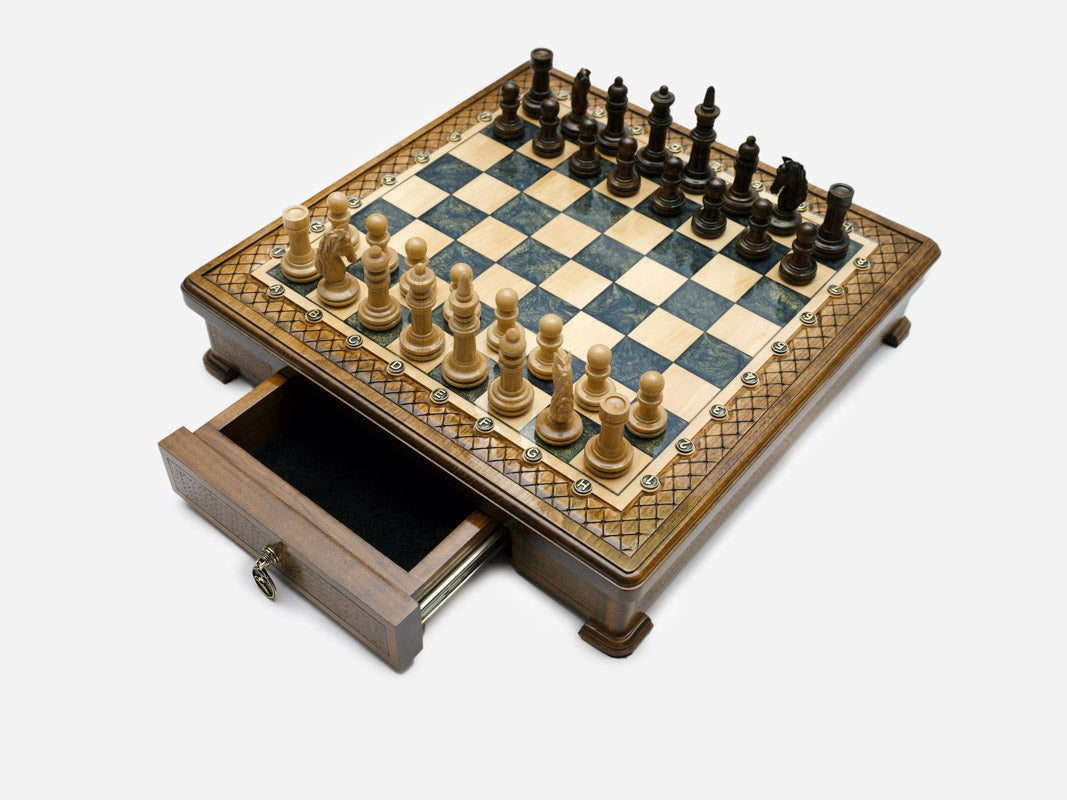Handle Gray Epoxy chess set with pieces set up and drawer open, angled view
