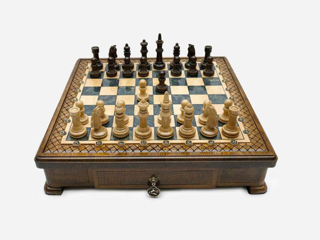 Handle Gray Epoxy chess set with wood pieces set up for play, front view