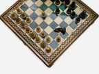 Handle Gray Epoxy chess set, angled top-down view of the board and pieces