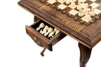 Handmade wooden chess table in a dramatic setting