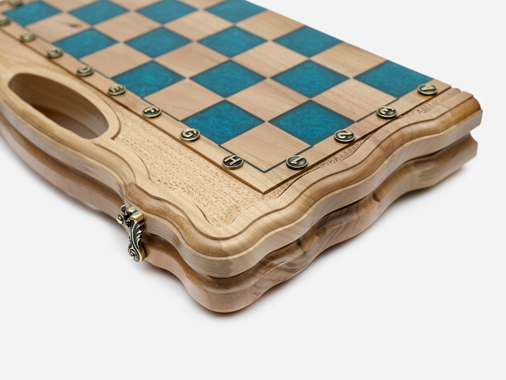 Close-up of the glossy turquoise epoxy squares, maple light squares and bronze coordinate markers