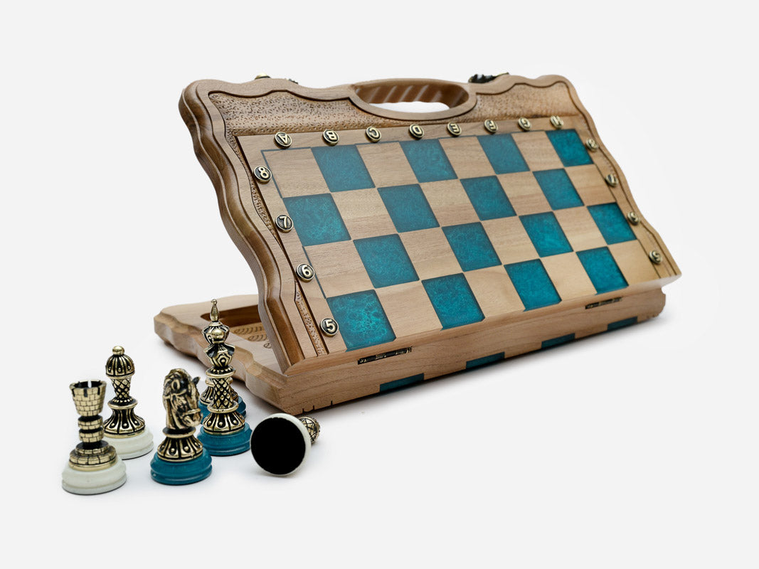 Angled view of the blue epoxy folding chess set with its bronze pieces set up