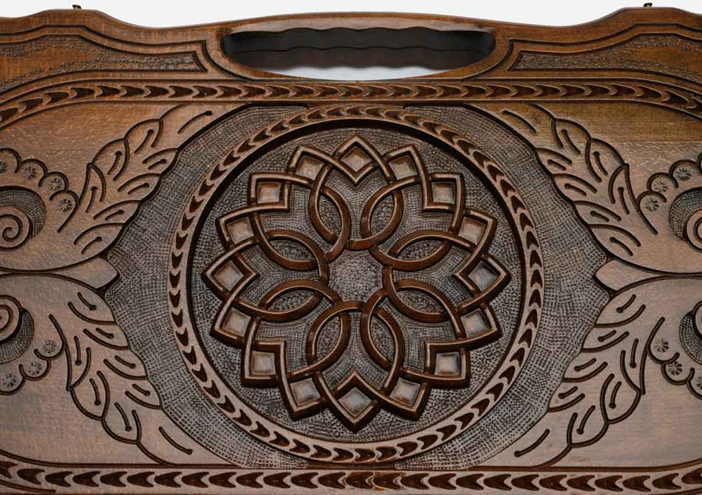 The backgammon board opened to show the wooden playing surface