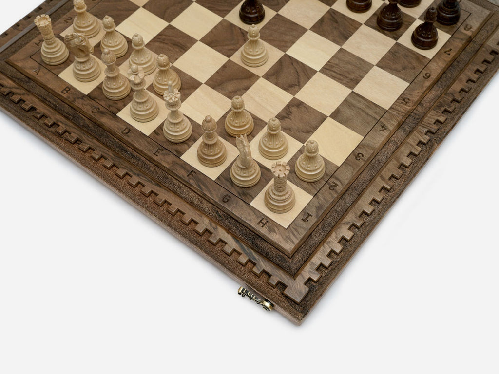 Close-up of a lattice design carving on the walnut board