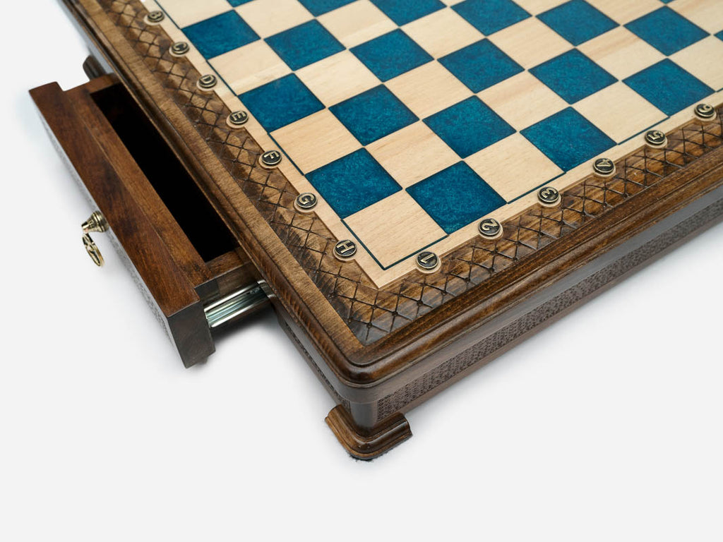 Close-up of the blue epoxy board corner on the Handle chess set
