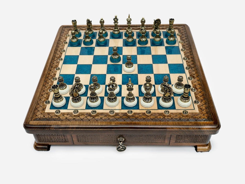 Handle Blue Epoxy chess set with bronze pieces set up for play, front view