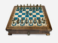 Handle Blue Epoxy chess set with bronze pieces set up for play, front view