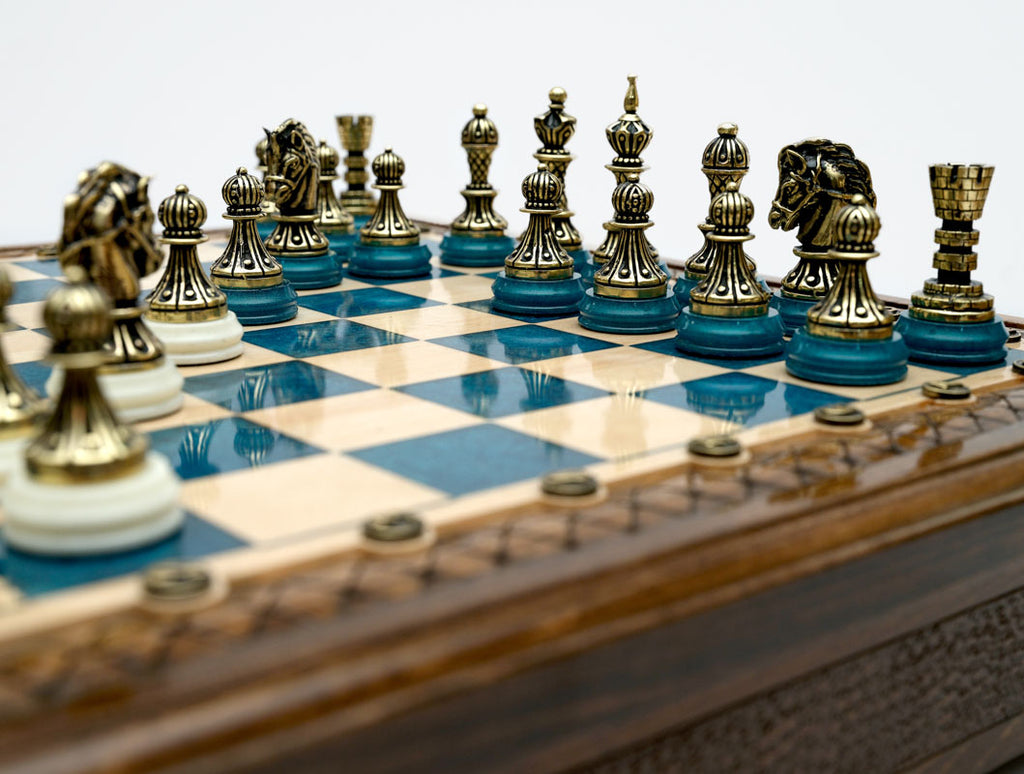Close-up of the bronze chess pieces on the Handle Blue Epoxy board