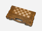 Classic chess and backgammon set shown folded with carry handle