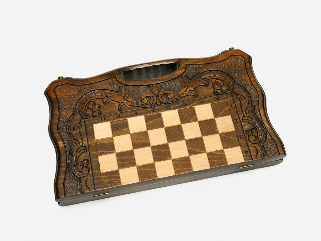 Angled view of the carved folding chess set with beech and walnut pieces set up