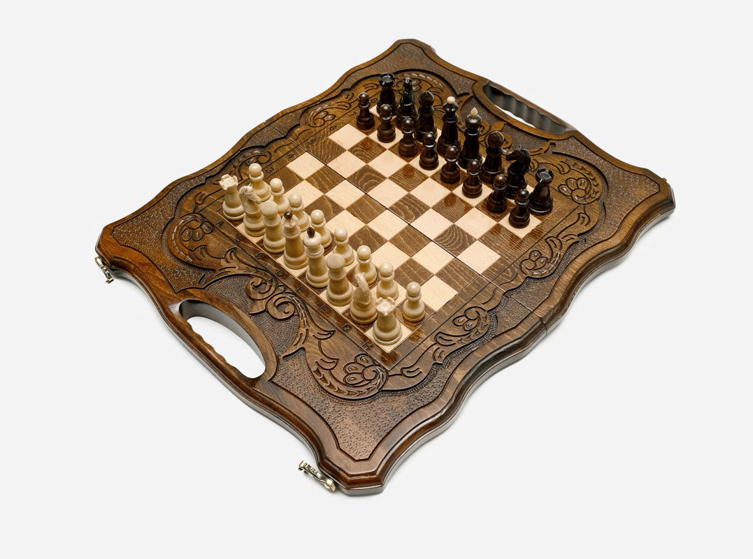 Interior of the opened board with carved backgammon points and a felt-lined base