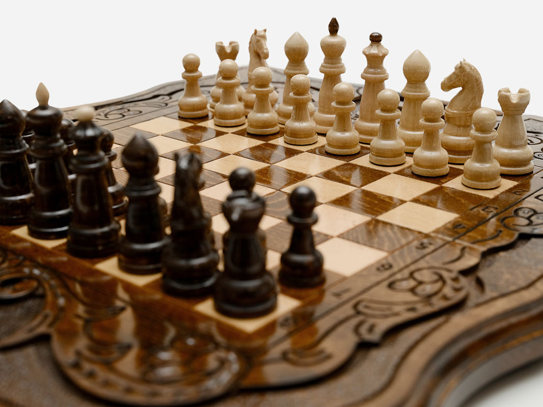 Detail of the beech and walnut chess pieces on the inlaid squares