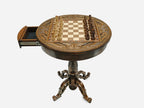 Round chess table with open storage drawer and chess pieces in starting position