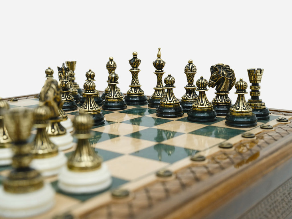 Close-up of the bronze chess pieces on the Handle Green Epoxy board