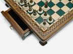 Close-up of the drawer corner and bronze chess pieces on the Handle Green Epoxy set
