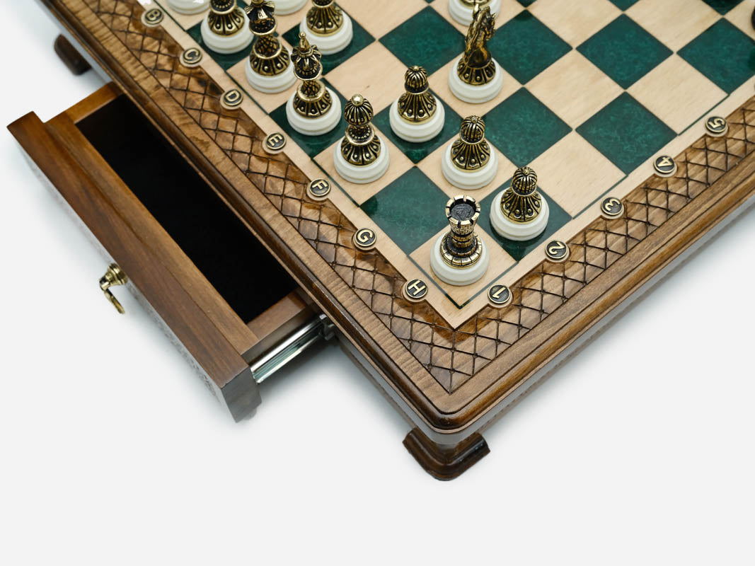 Close-up of the drawer corner and bronze chess pieces on the Handle Green Epoxy set