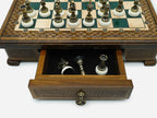 Close-up of the Handle Green Epoxy chess set drawer with bronze pieces stored inside