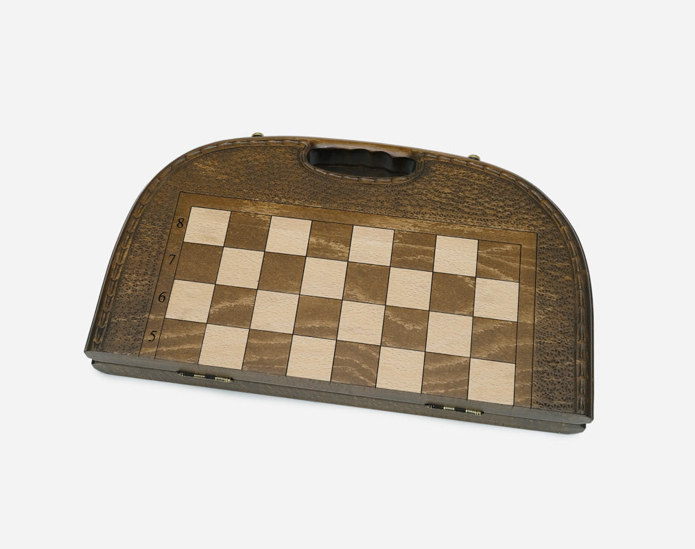 The chess-backgammon set shown closed, ready to carry