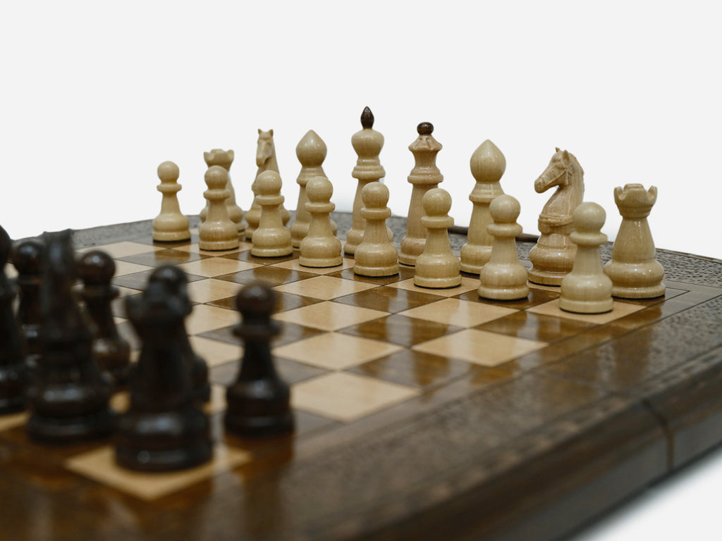Detail of the beech and walnut chess pieces on the inlaid squares