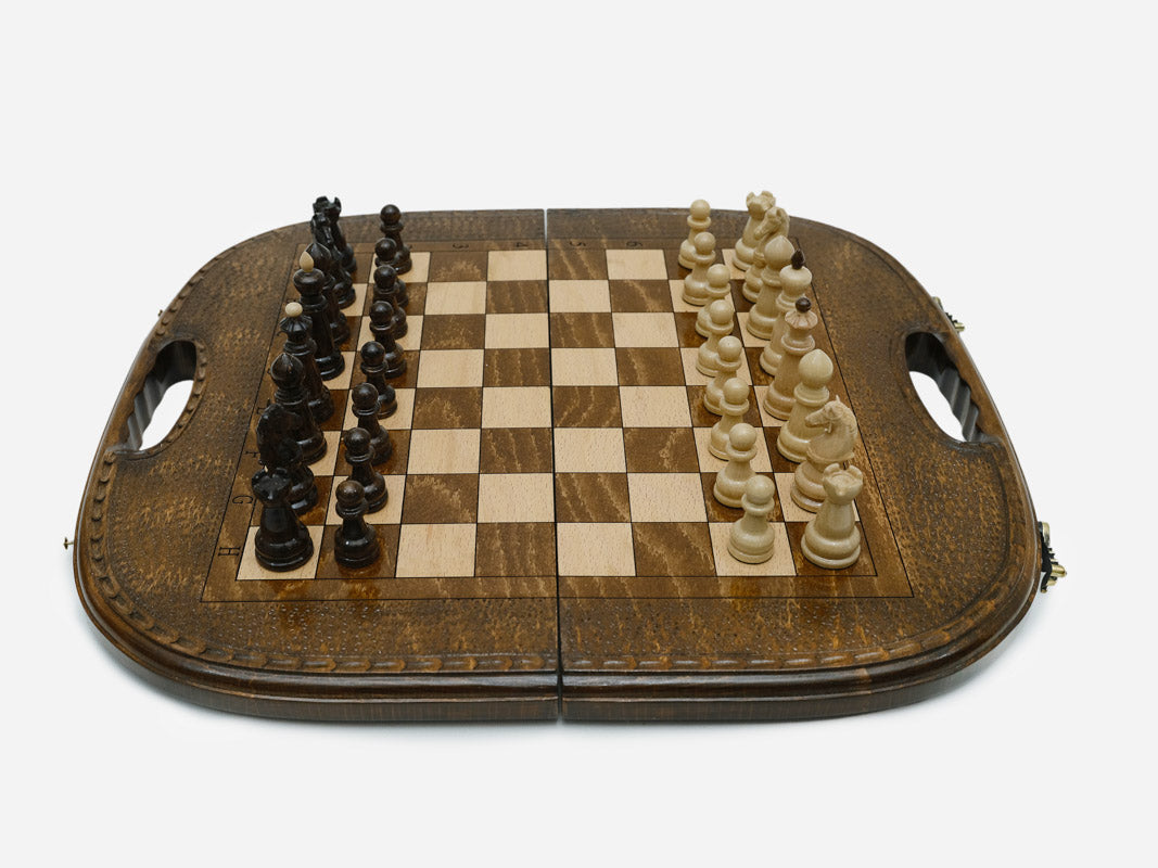 Angled view of the chess-backgammon set opened flat