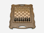 The folding chess board partly closed, showing its briefcase form