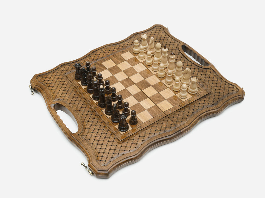 Close-up of the beech and walnut chess pieces on the inlaid squares