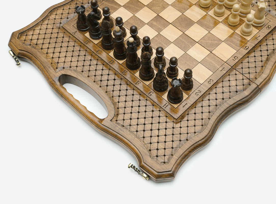 Overhead view of the chessboard and its lattice-engraved border