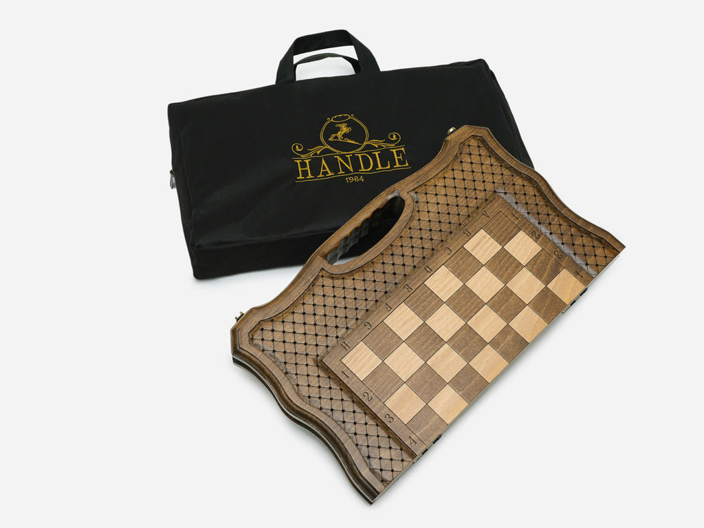 The folding chess board beside its branded black Handle carry bag