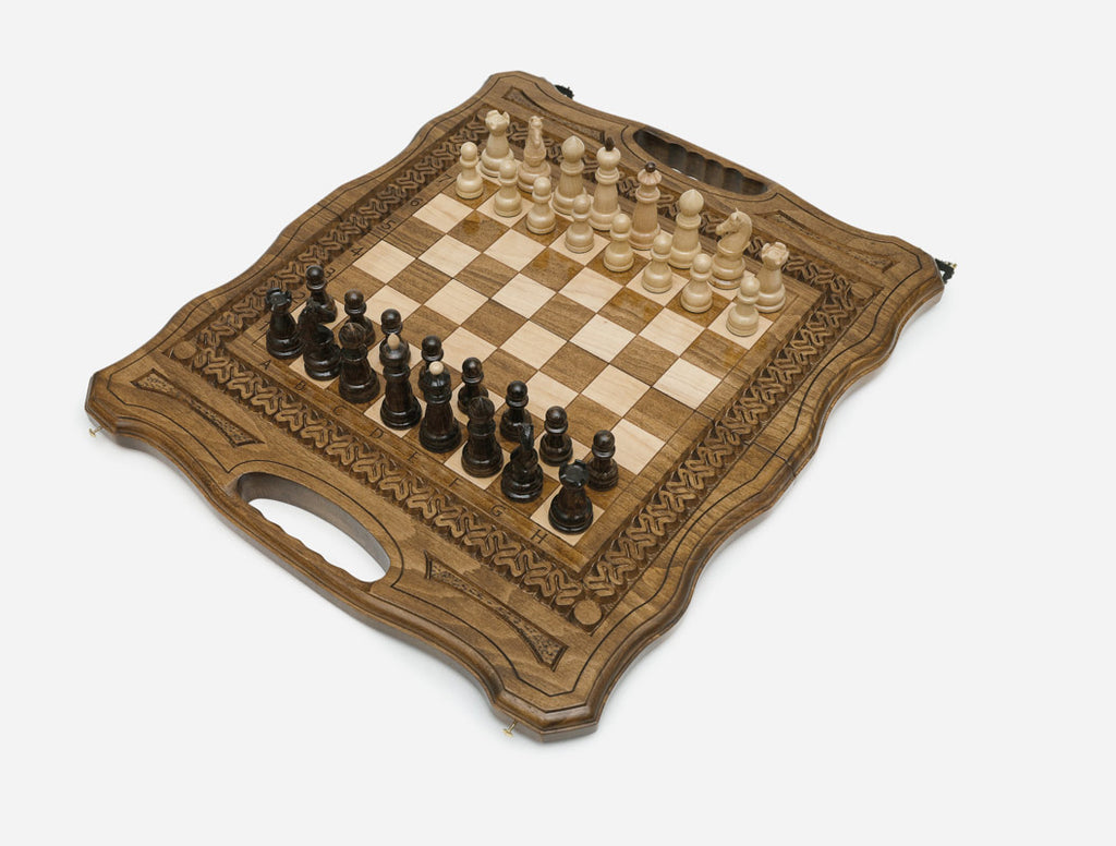 Angled view of the ornate folding chess board set up for play