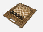 Angled view of the ornate folding chess board set up for play