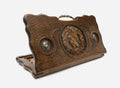 Carved beechwood backgammon board with a lion, bronze lion medallions and an ornate bronze handle, propped open