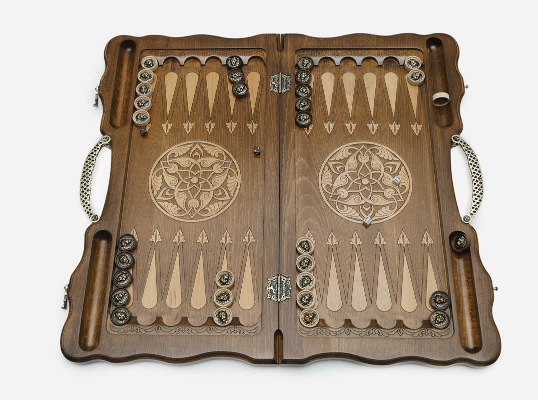 The ornate bronze carry handle