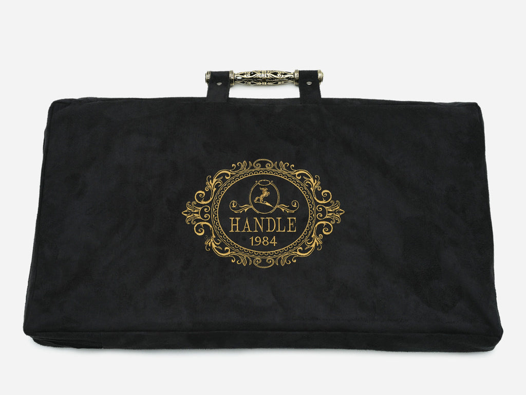 Angled view of the lion carved backgammon board with bronze handle