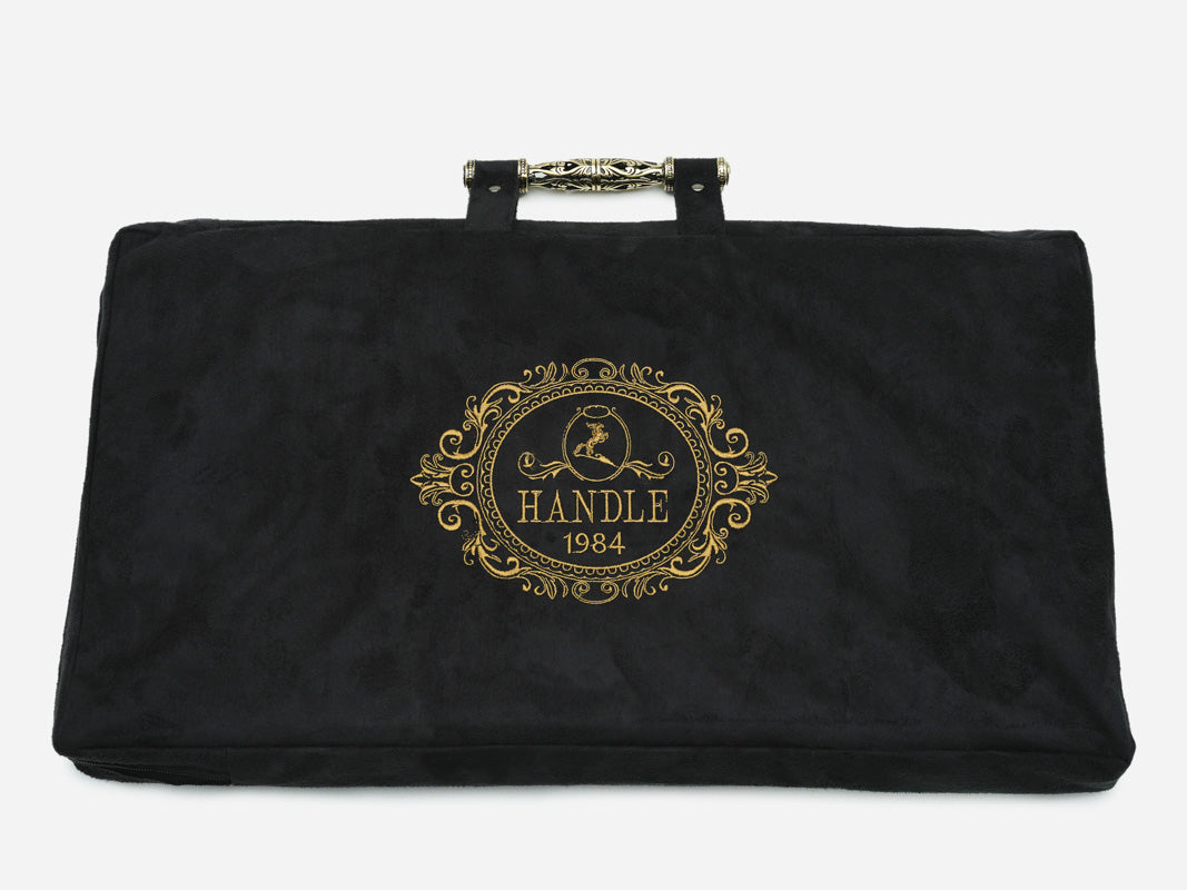 Angled view of the lion carved backgammon board with bronze handle