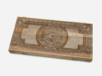 Close-up of the walnut grain and silver inlay