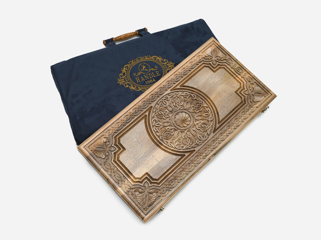 The backgammon board opened to show the wooden playing surface
