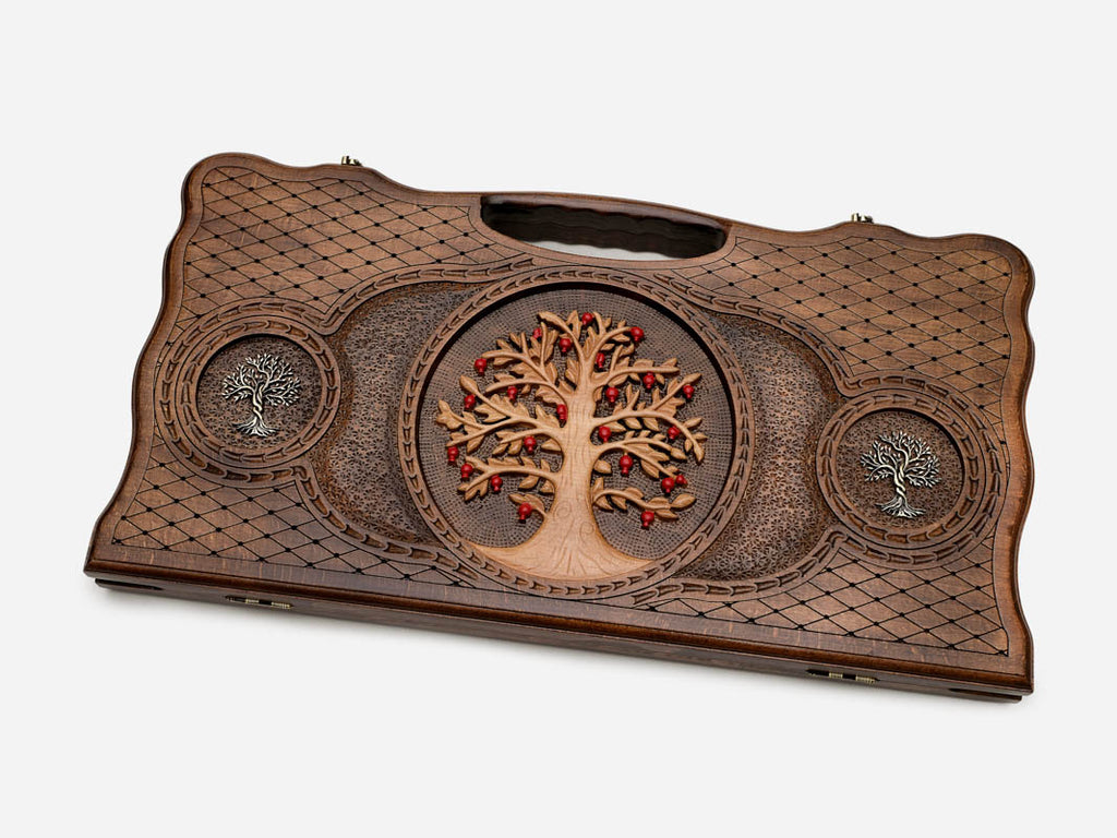 Angled view of the tree of life carved backgammon board