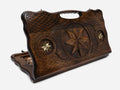 Carved beechwood backgammon board with an octagonal bronze medallion and a carry handle, propped open