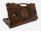 Carved beechwood backgammon board with a lion and bronze lion medallions, with a carry handle, propped open