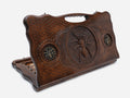 Carved beechwood backgammon board with a spider medallion and bronze accents, with a carry handle, propped open