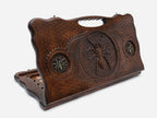 Carved beechwood backgammon board with a spider medallion and bronze accents, with a carry handle, propped open