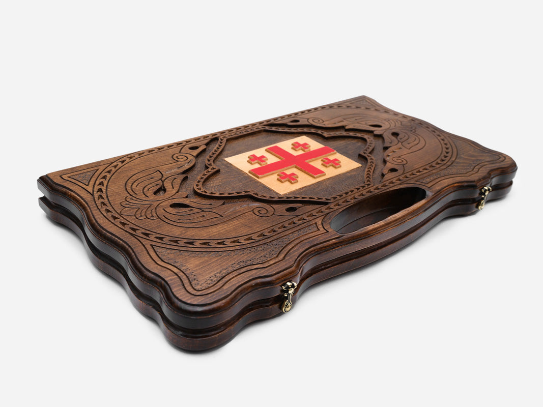The backgammon board opened to show the wooden playing surface