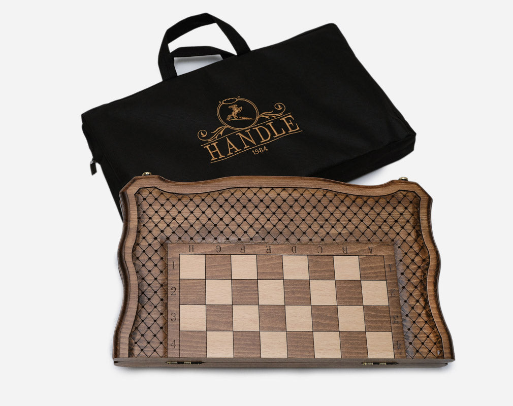 Handle 1984 chess set closed with its branded black carrying bag