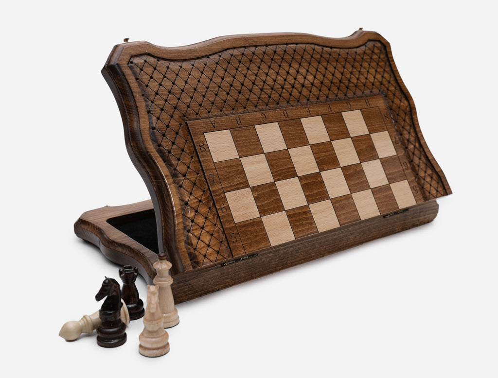 Handle chess board propped upright showing the open storage compartment for pieces